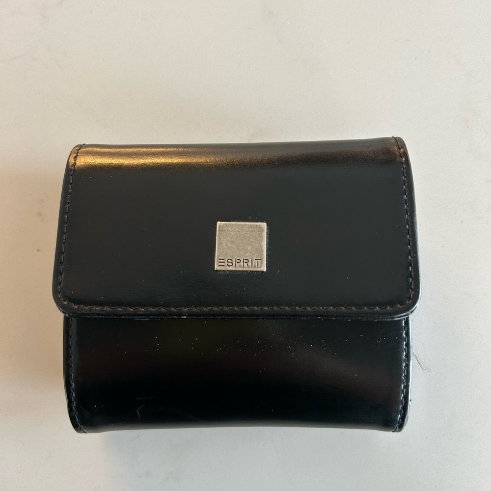 Esprit trifold faux leather wallet 
Credit card , bill & change compartments.